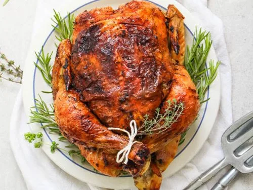 White Wine and Herb Roasted Whole Chicken is made easy with these simple steps! Juicy meat, crispy skin, and loads of flavor, this dish is a true classic!