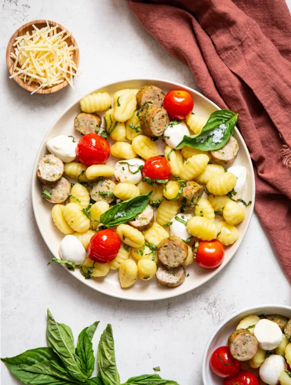 Sheet pan gnocchi Caprese with asiago spinach sausage is a quick and easy 20 minute meal that is healthy, packed with flavor, and fresh!