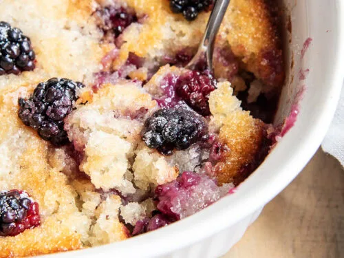 This Blackberry Cobbler is one of those desserts you'll want to make all summer long! It has sweet juicy blackberries that are baked into a soft buttery cobbler topping. It's super easy to make, and