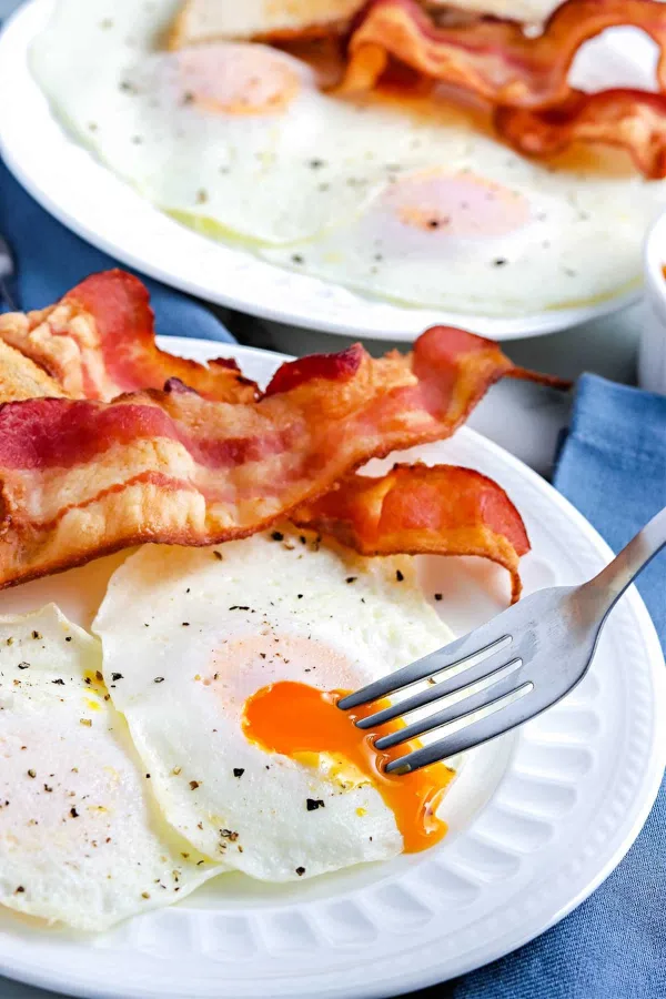 Making over easy eggs is just that, easy! All you need are eggs, butter, salt, and pepper. Making this recipe takes just a few minutes.